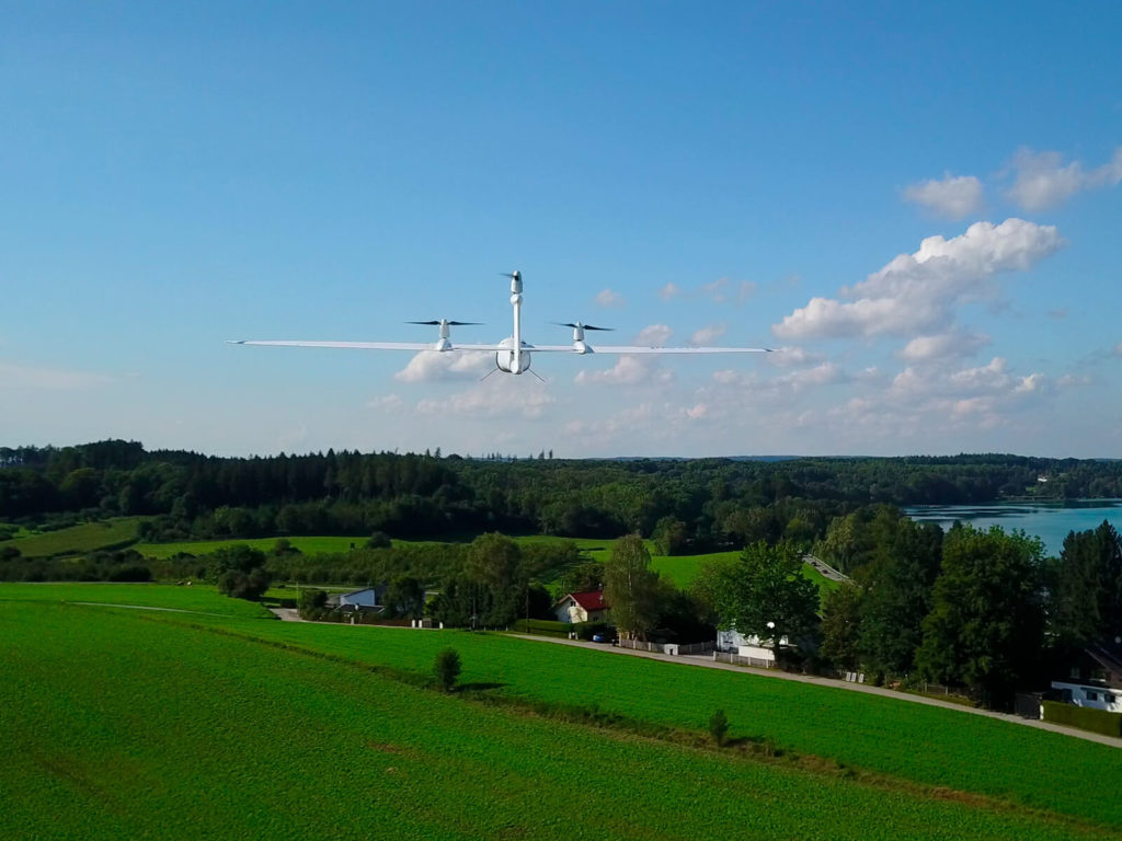 Aerial view of 3D printed drone above farmland